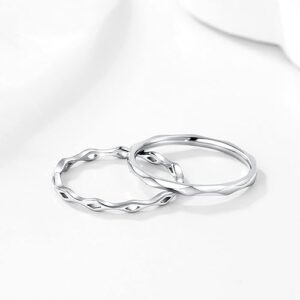 Woman wearing KAZITSAN stainless steel stacking rings with Celtic knot design